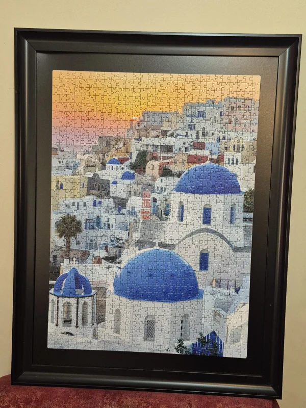 تابلو پازل هزار قطعه از برند CLEMENTONI منظره شهرSantorini،قاب شده.