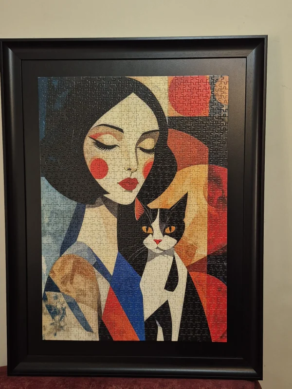 تابلو پازل هزار قطعه از برند ART Puzzles تصویر دختر و گربه،قاب شده‌